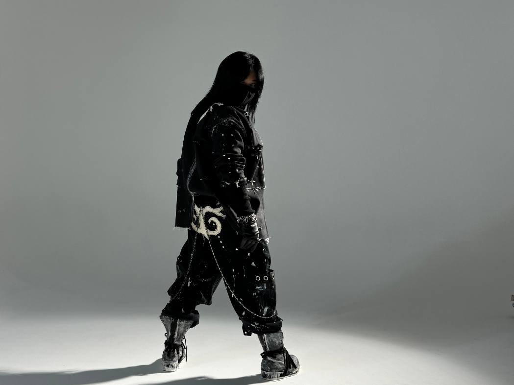 EULER studio look — black layered silhouette with white ornament