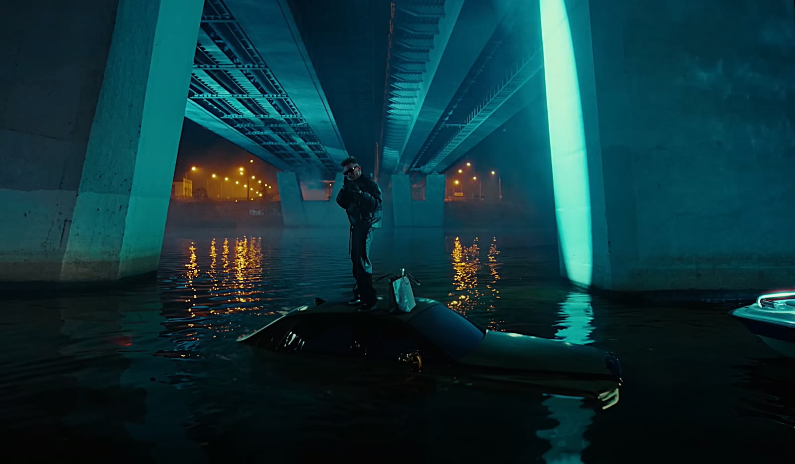 URUS music video — artist standing on a car under the bridge
