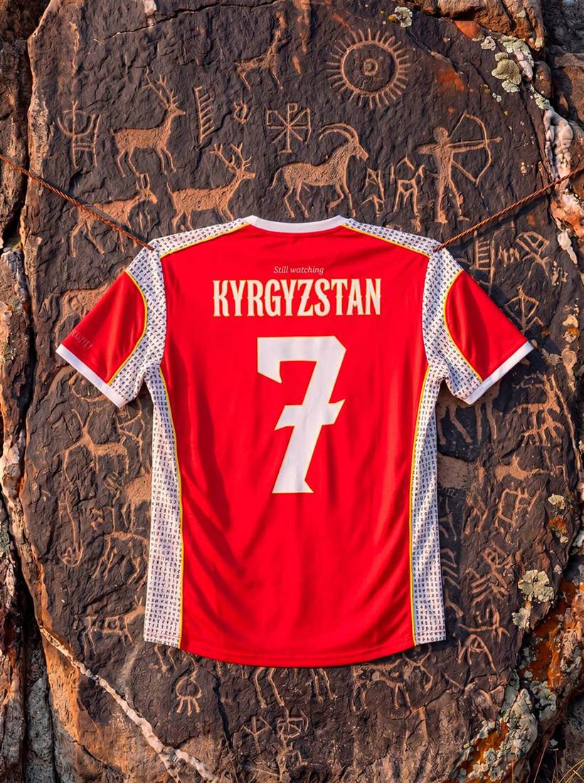 Kyrgyzstan national jersey N°7 shot on petroglyph rock
